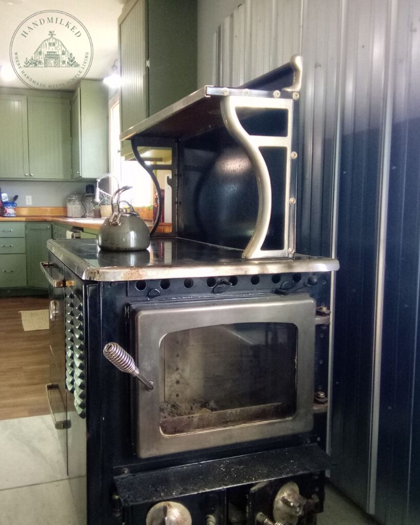 A woodstove provides heat and is a great cooking option, saving you money in multiple ways.